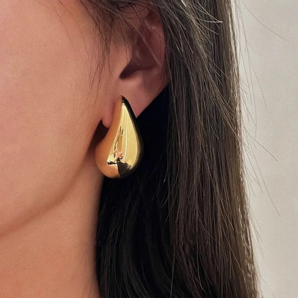 blog post image - gold color teardrop shape earring